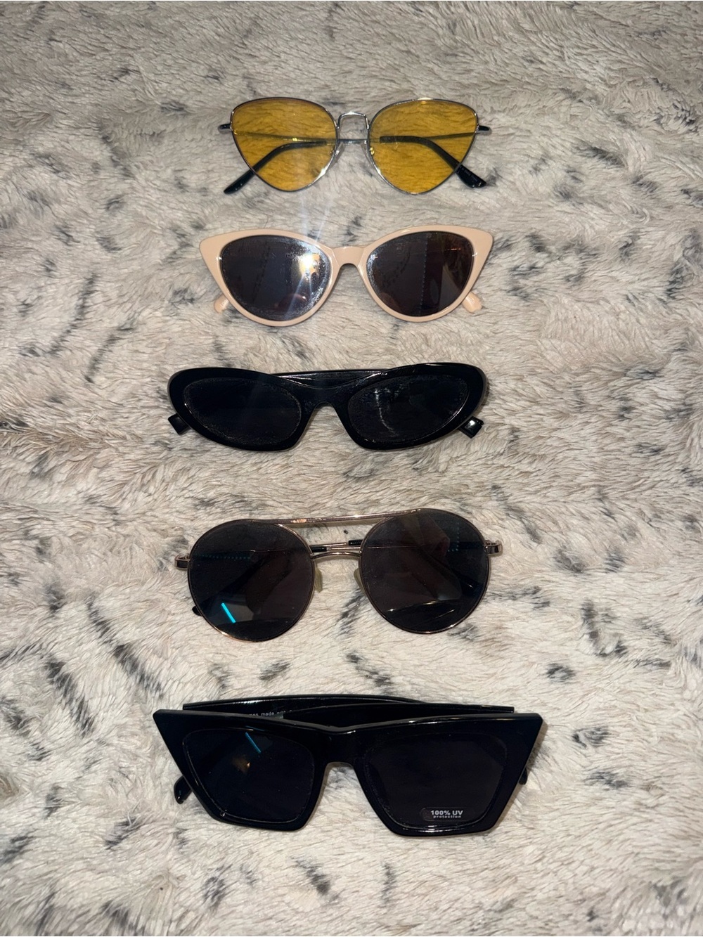 Five pairs of Y2k women's sunglasses, various styles and colors